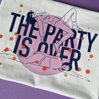 T-shirt with illustration of people lying down and text 'The Party is Over' on a white background with orange dots.