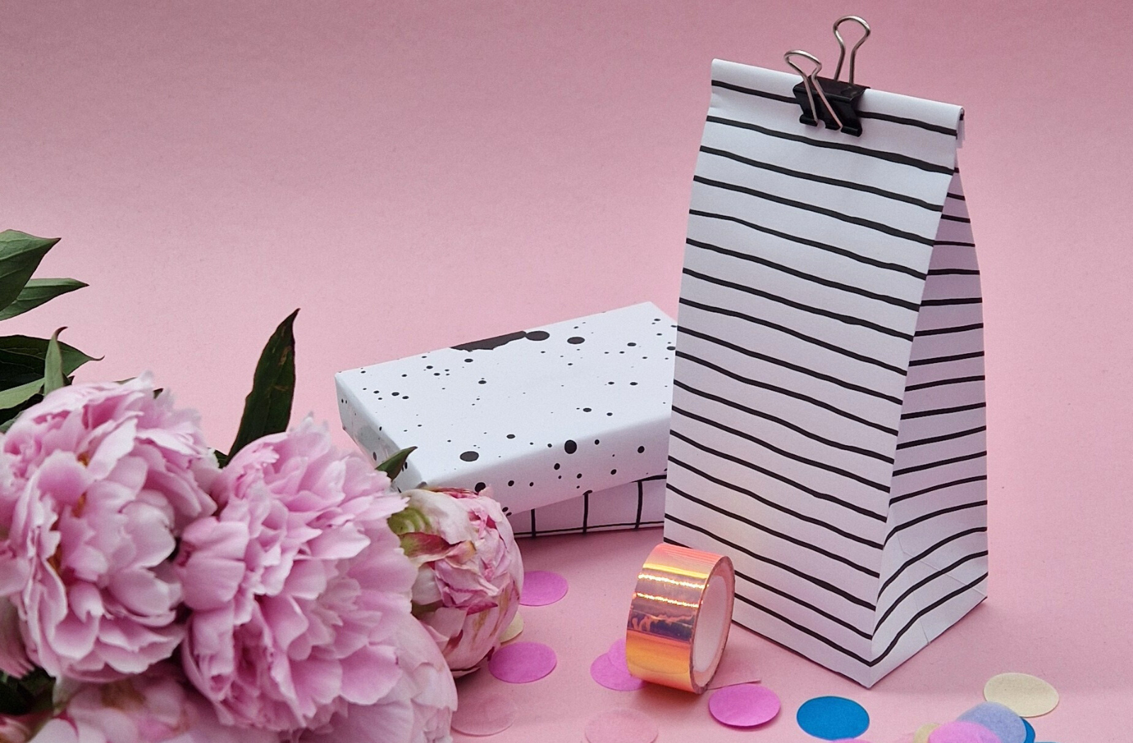 Step-by-step guide to print and fold paper bags at home on a pink background.